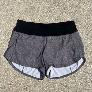 Size 6 gray and black speed up lululemon shorts 4 inches
